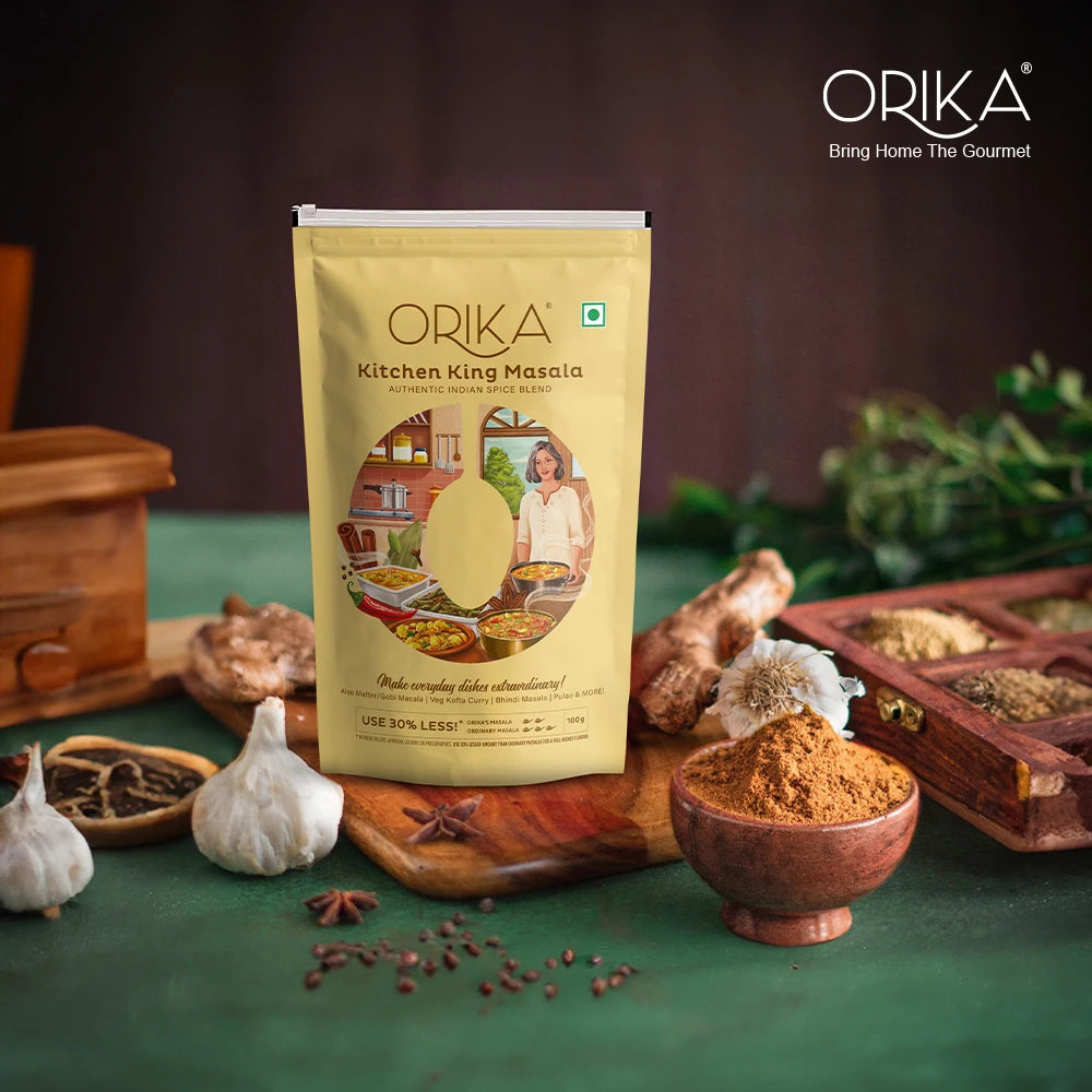 Orika Kitchen King Masala packaging with spices and ingredients on a green background